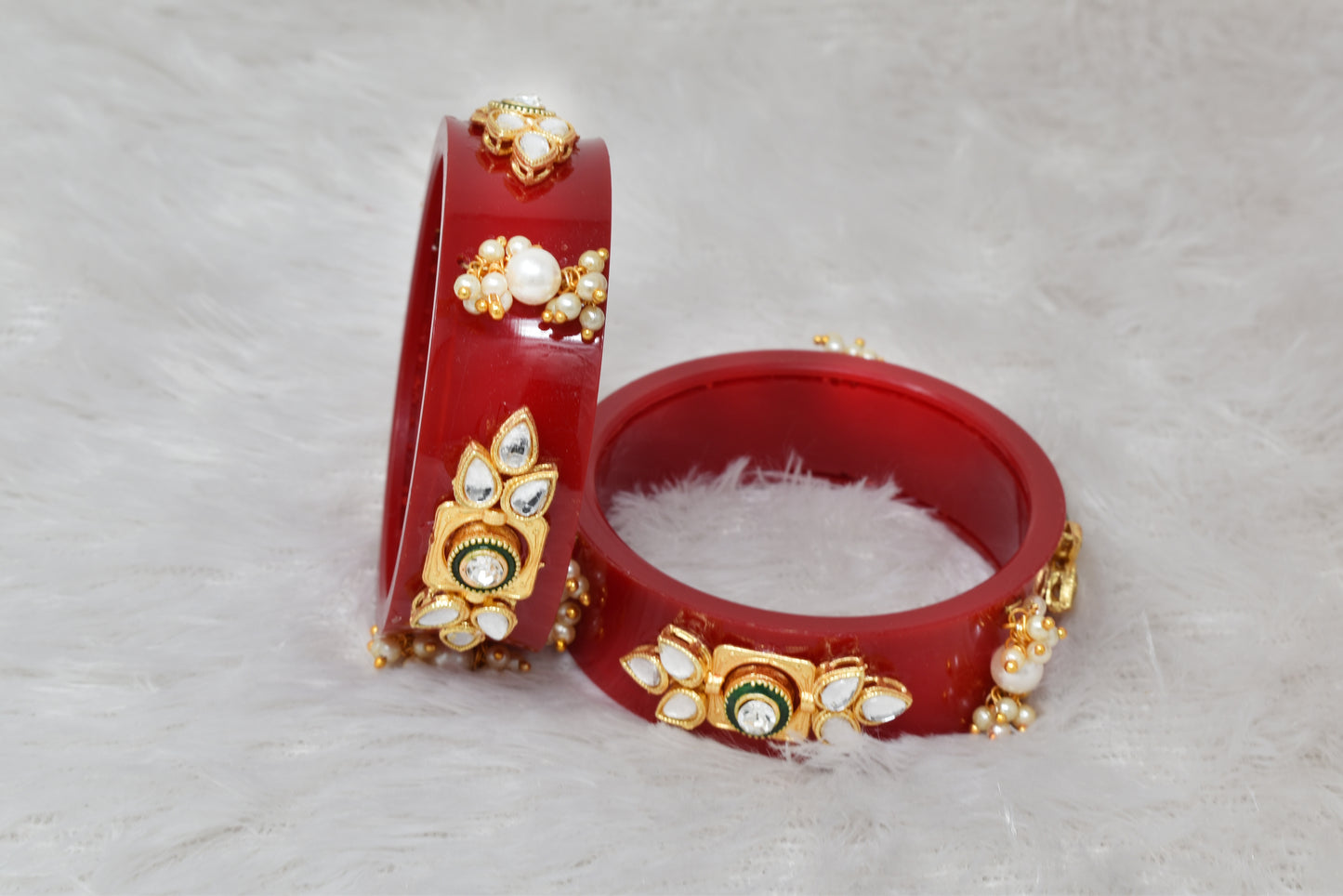 Plastic bangles studed with kundan and pearl work