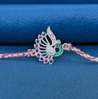 Feathered Grace – Peacock Ties Rakhi 925 Silver Rakhi