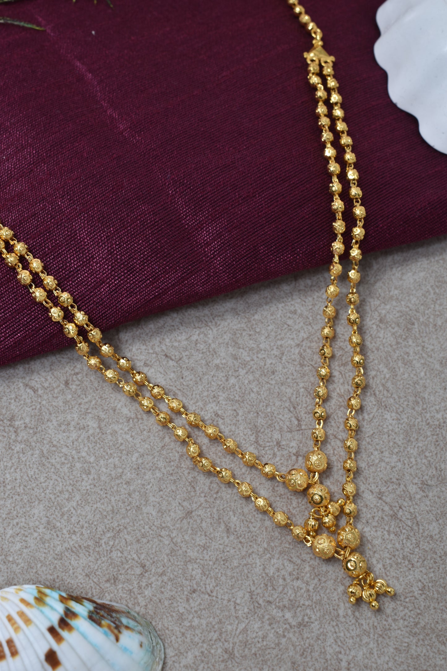 Traditional Gold-Toned Layered Beaded Ethnic Necklace with Dangling Charm Details for Women