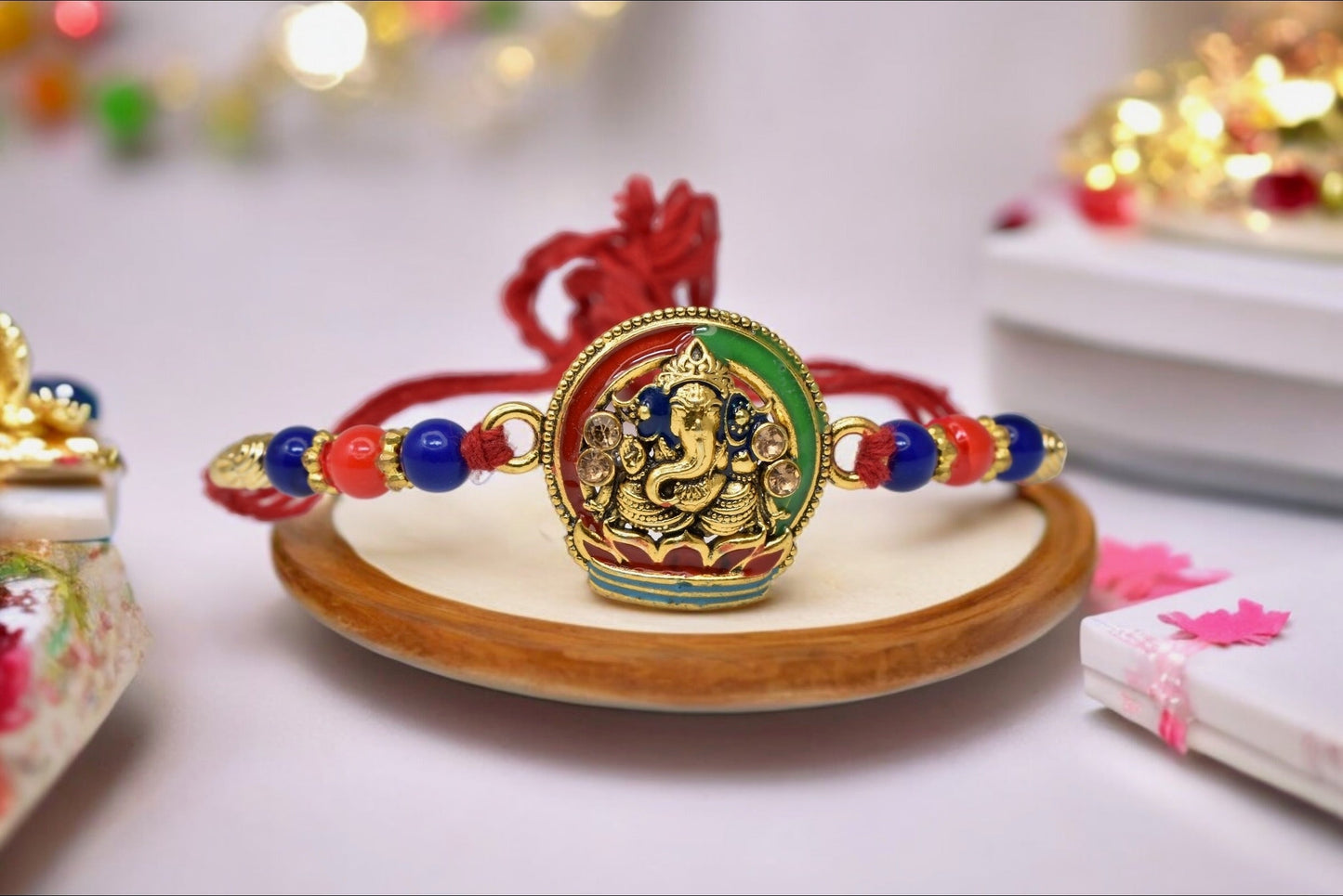 Elegant Lord Ganesh with Lotus  Gold plated Antique rakhi1 Rakhi Made from Cotton Threds with Pack of Roli Chawal n Rakshabandhan Greetings Card |rakhi for brother|Bhaiya Rakhi | Kids rakhi |Rakhi for kids|Rakhi for Bhaiya