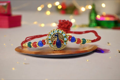 Beautiful Round Peacock on Lotus Morpaankh Kundan Stone Multicolored  Rakhis 1 Rakhi Made from Cotton Threds with Pack of Roli Chawal n Rakshabandhan Greetings Card |rakhi for brother|Bhaiya Rakhi | Kids rakhi |Rakhi for kids|Rakhi for Bhaiya