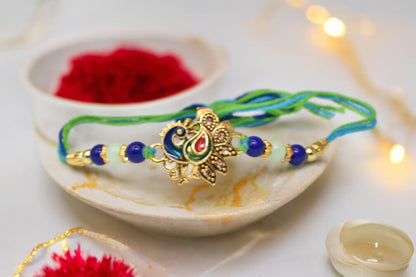 Elegent Round Peacock on Morpaankh Goldplated Kundan Stone Multicolored  Rakhis 1 Rakhi Made from Cotton Threds with Pack of Roli Chawal n Rakshabandhan Greetings Card |rakhi for brother|Bhaiya Rakhi | Kids rakhi |Rakhi for kids|Rakhi for Bhaiya