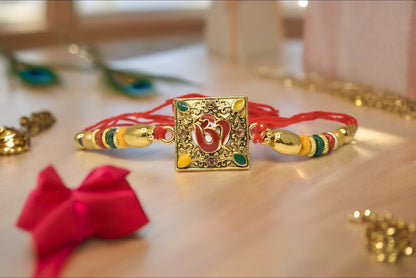 Spiritual OM Square shapes Divine Goldplated  Multicolored  Rakhis 1 Rakhi Made from Cotton Threds with Pack of Roli Chawal n Rakshabandhan Greetings Card |rakhi for brother|Bhaiya Rakhi | Kids rakhi |Rakhi for kids|Rakhi for Bhaiya