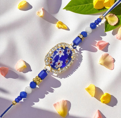 Resin Style AD Studded Heavy Designer Rollstone Blue Rakhi