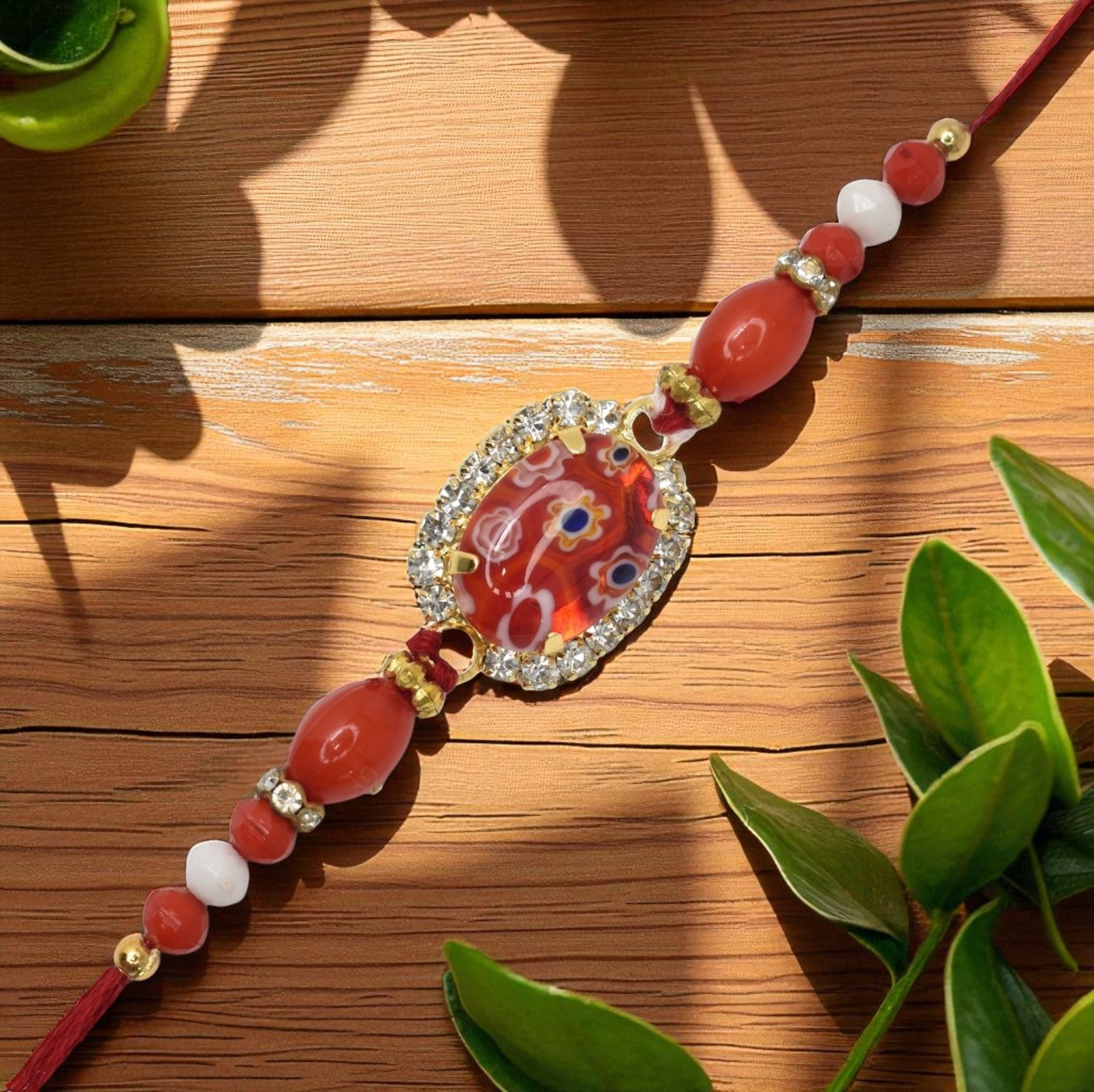 Resin Style AD Studded Heavy Designer Rollstone Red Rakhi