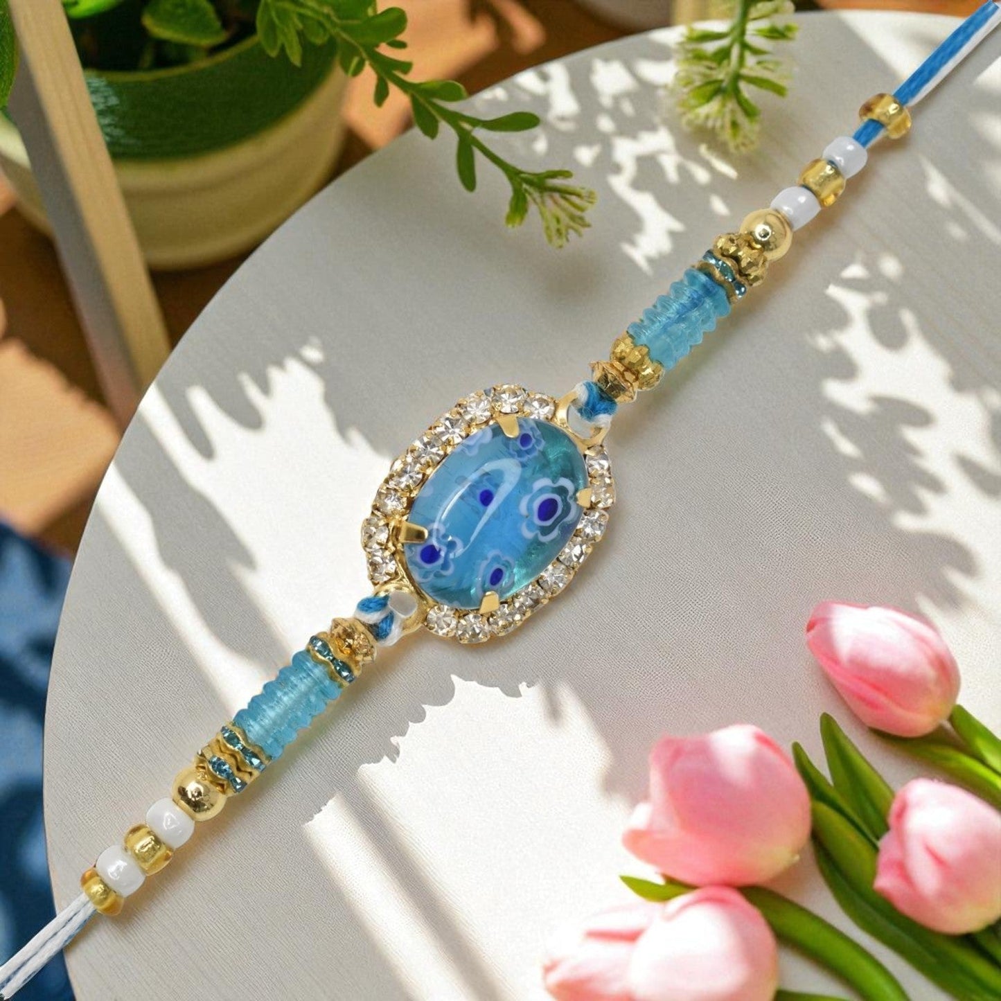 Resin Style AD Studded Heavy Designer Rollstone Sky Blue Rakhi