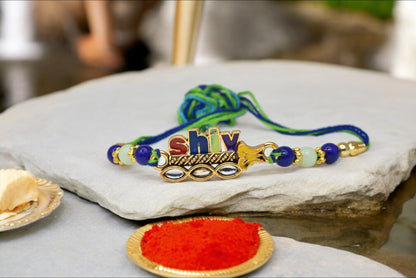 Religious Designer Shiv Spritual Aesthtic Rakhis  Divine Goldplated  Multicolored  Rakhis 1 Rakhi Made from Cotton Threds with Pack of Roli Chawal n Rakshabandhan Greetings Card |rakhi for brother|Bhaiya Rakhi | Kids rakhi |Rakhi for kids|Rakhi for Bhaiya