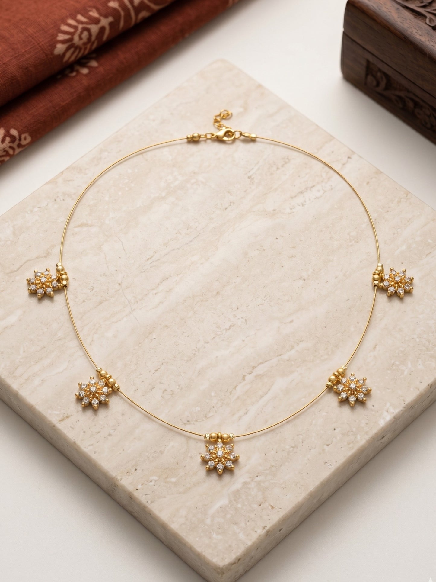 Gold-Toned Delicate Charm Wire Necklace with Sparkling Floral Motifs