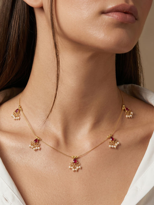 Gold-Toned Pearl Drop Wire Necklace with Red Stone Charms