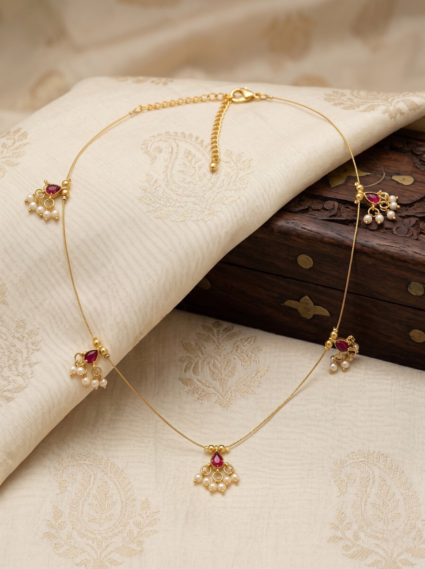 Gold-Toned Pearl Drop Wire Necklace with Red Stone Charms